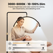 Woman applying eyelashes with a lamp providing precise brightness and color control for skincare treatments.