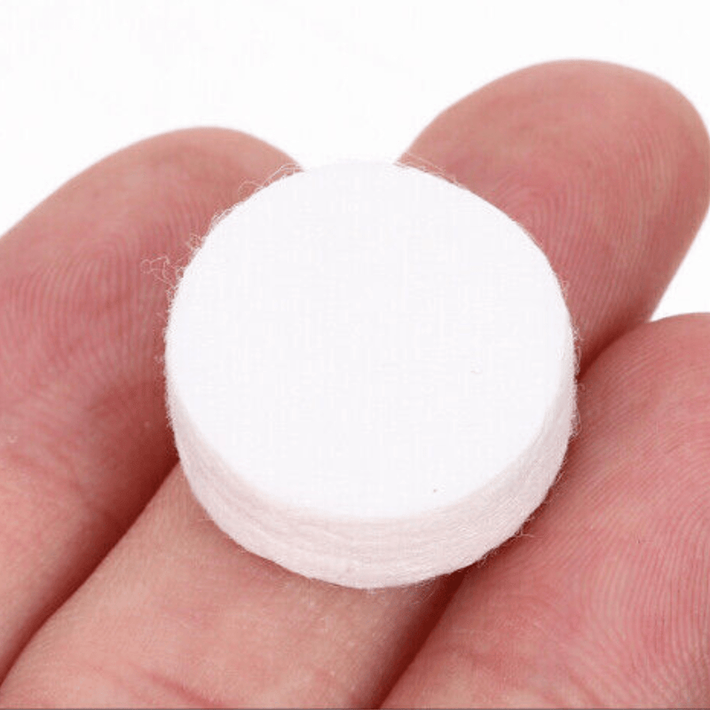 COMPRESSED COIN MASK IN HAND