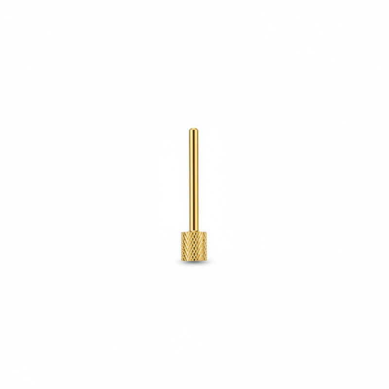 A single gold-colored metal nail drill bit with a straight post and a textured, knurled circular base, shown against a plain white background.