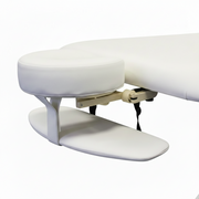White massage table with adjustable headrest on a white background adjustable face cradle with arm rest for massage couch