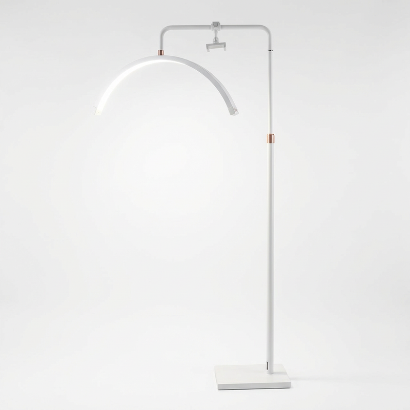 White floor lamp with curved arm on a white background