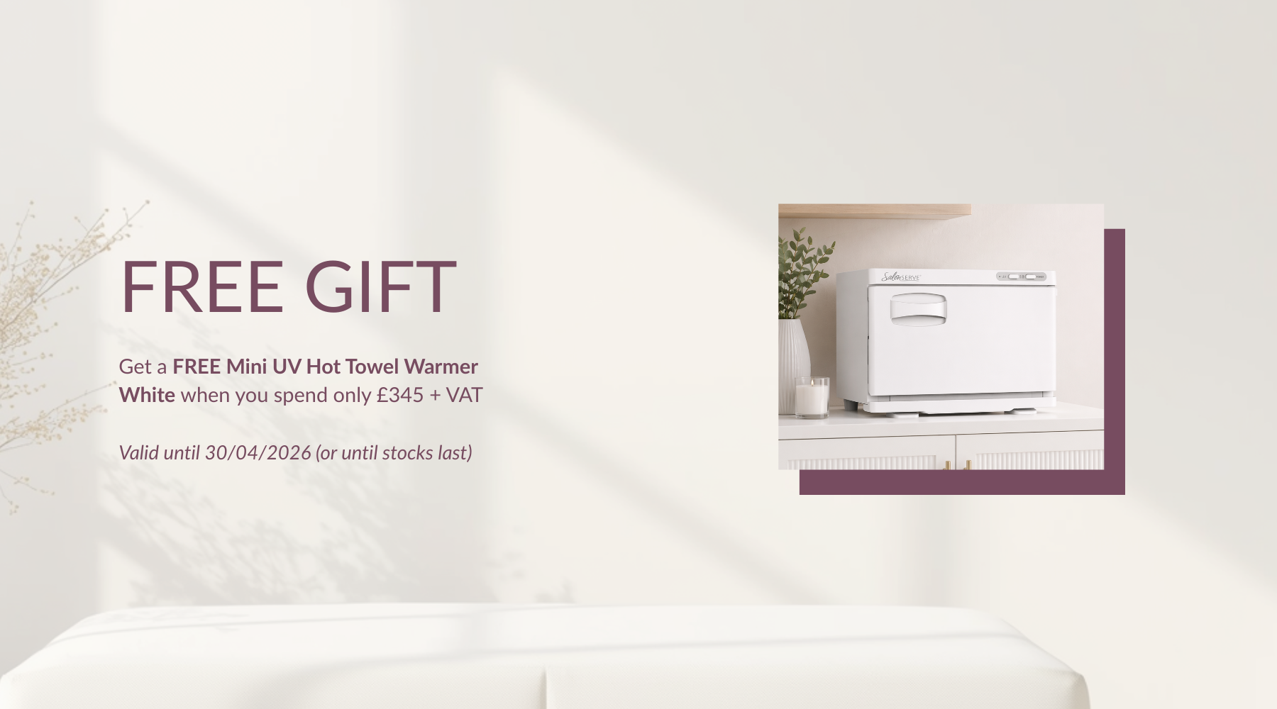 Advertisement for a free gift with a white UV hot towel warmer on a white background.