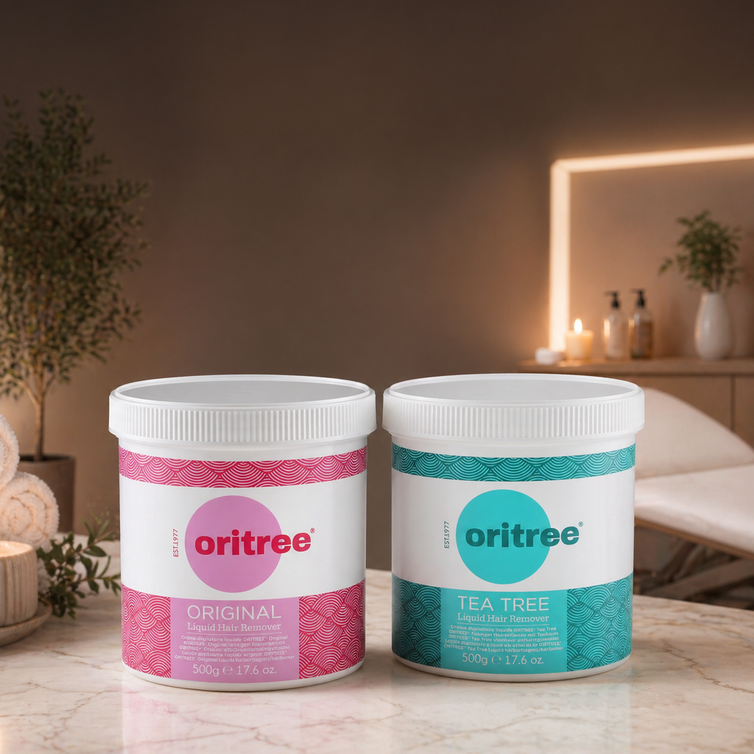 Two Oritree wax pot liquid hair remover containers on a table with a blurred background of a room.