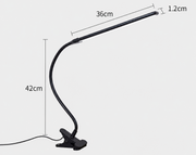 Black adjustable clip-on lamp with measurements on a white background
